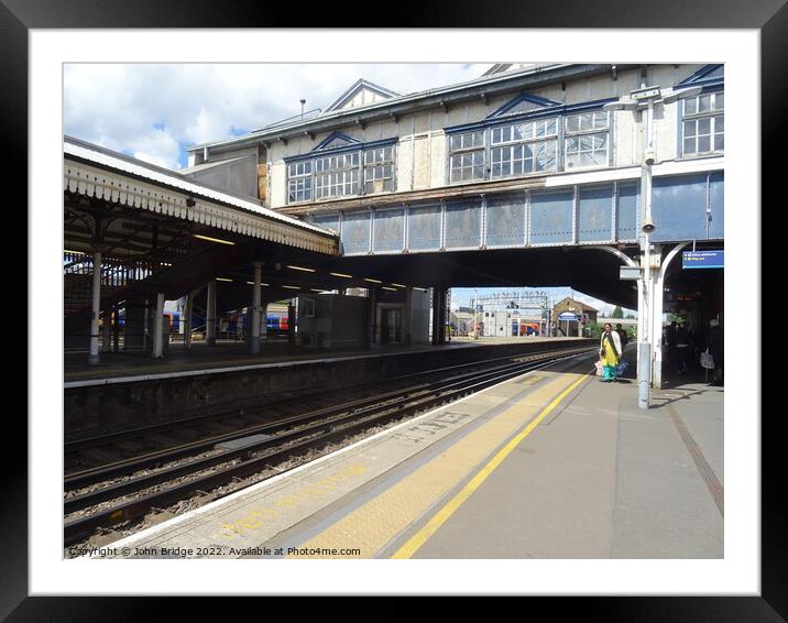 Clapham Junction Footbridge and Platform Framed Mounted Print by John Bridge