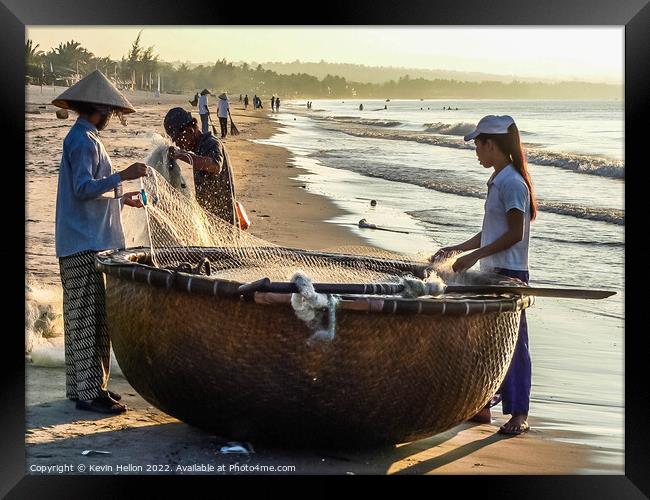 Folding the nets, Mui Ne, Vietnam Framed Print by Kevin Hellon