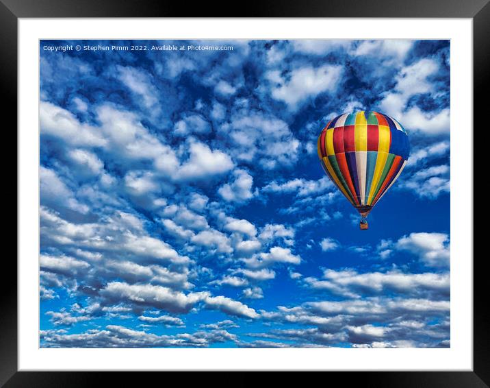 A colorful ballon flying in the sky Framed Mounted Print by Stephen Pimm