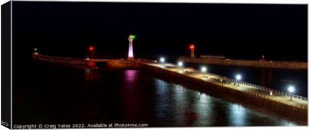 Whitby Lighthouse and Pier Night Shot. Canvas Print by Craig Yates