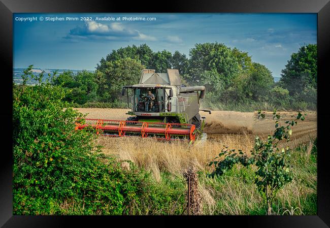 Combine Harvesting the Field Framed Print by Stephen Pimm