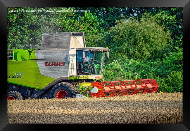 A Combine Harvesting the Field Framed Print by Stephen Pimm