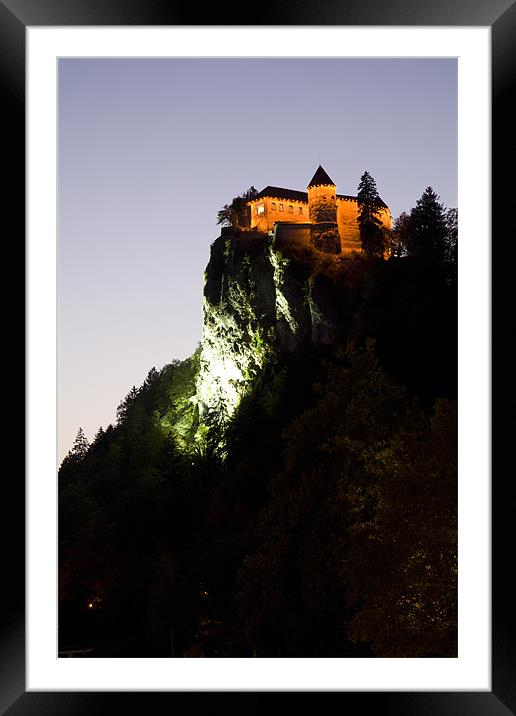 Bled castle lit up at night Framed Mounted Print by Ian Middleton