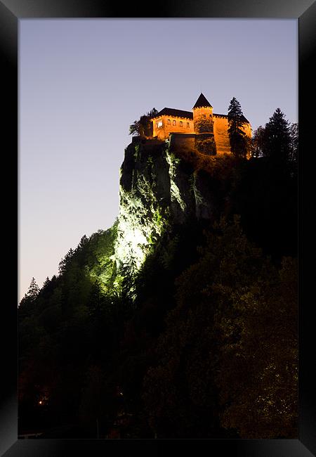 Bled castle lit up at night Framed Print by Ian Middleton
