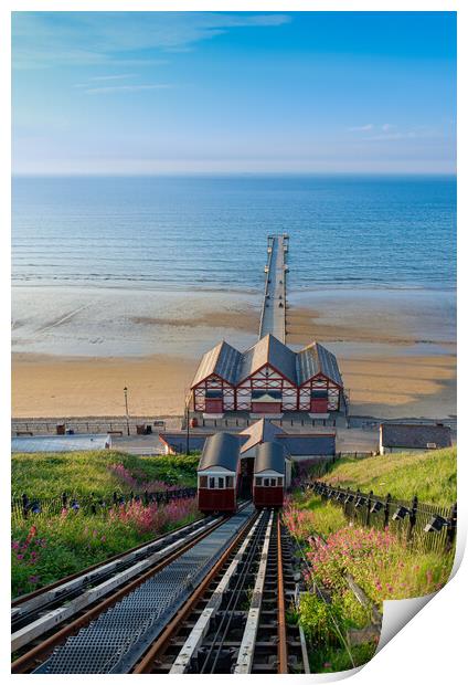 Saltburn cliff lift and pier Print by Kevin Winter