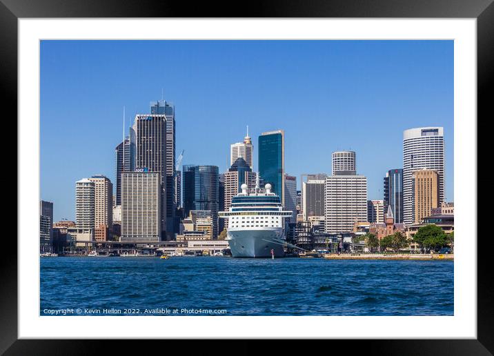 Cruise ship moored in Sydney Harbour with the Central Business D Framed Mounted Print by Kevin Hellon
