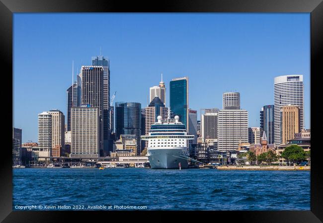 Cruise ship moored in Sydney Harbour with the Central Business D Framed Print by Kevin Hellon