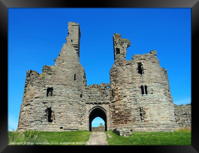 Dunstanburgh castle in northumbria Framed Print by Philip Openshaw