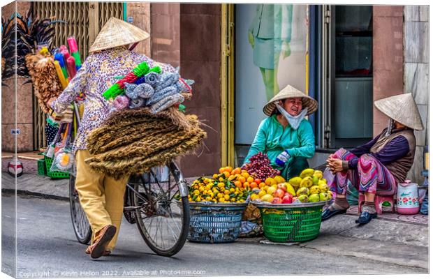 3 street vendors, Ho Chi Minh City, Saigon, Vietnam Canvas Print by Kevin Hellon