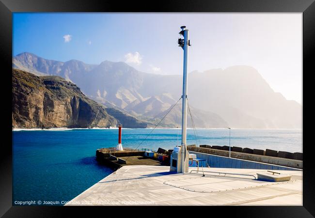 Entrance to the mouth of the port of Agaete with the beautiful c Framed Print by Joaquin Corbalan