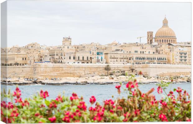 Pretty flowers in front of the Valletta skyline Canvas Print by Jason Wells