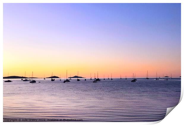 Boats in Silhouette against a Rainbow Sunset Print by Julie Gresty