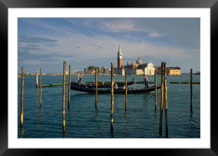 Venice, Italy  Wide angle shot gondolas floating in the canal against View of Bell Tower of St Mark Basilica in Venezia city and dramatic blue sky Framed Mounted Print by Arpan Bhatia
