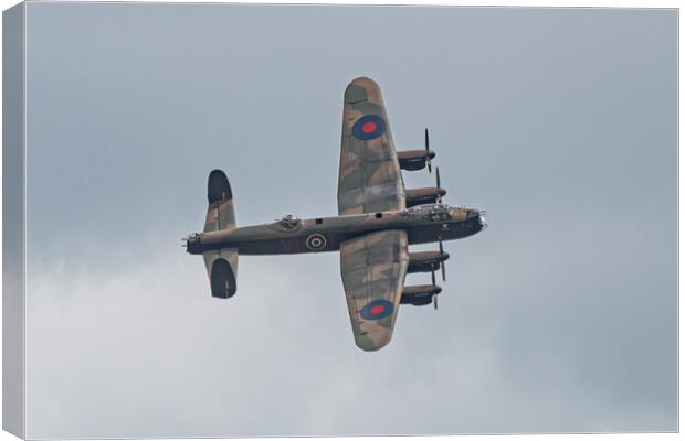 Majestic Lancaster Bomber Over Clouds Canvas Print by Alan Tunnicliffe