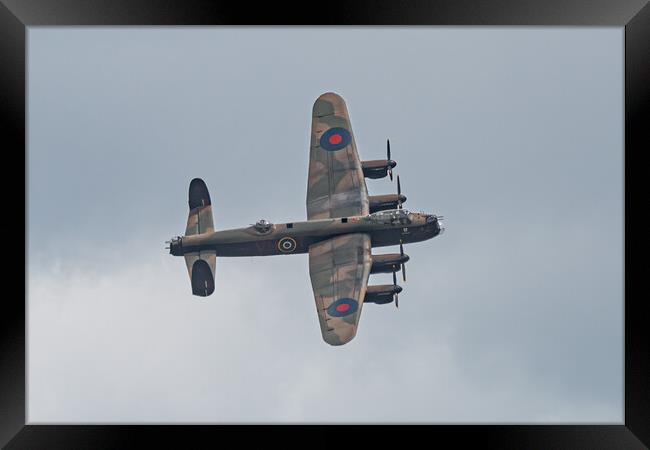 Majestic Lancaster Bomber Over Clouds Framed Print by Alan Tunnicliffe