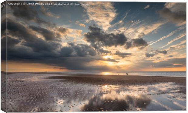 Sunset Reflections on Brancaster Beach Canvas Print by David Powley