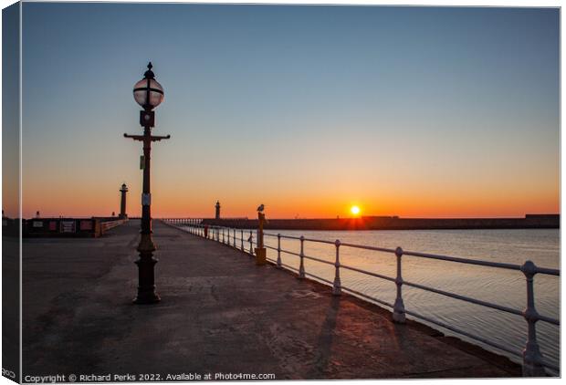 Sunrise on Whitby Pier Canvas Print by Richard Perks