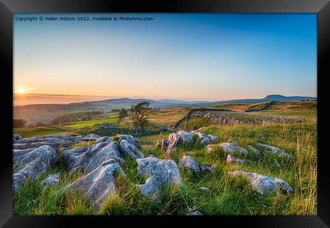 Sunset with clear blue skies over a limestone pavement at the Wi Framed Print by Helen Hotson