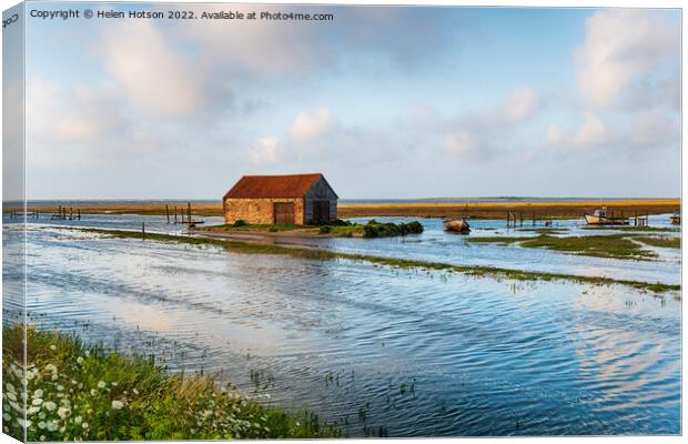 Spring tides flooding the old harbour at Thornham  Canvas Print by Helen Hotson