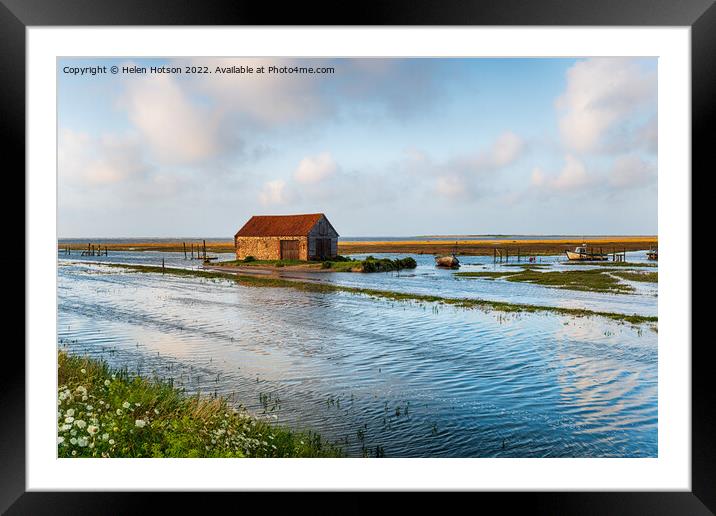 Spring tides flooding the old harbour at Thornham  Framed Mounted Print by Helen Hotson