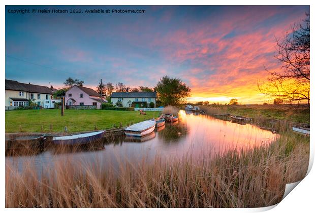 Stunning sunset over the village green and boats on the river at Print by Helen Hotson