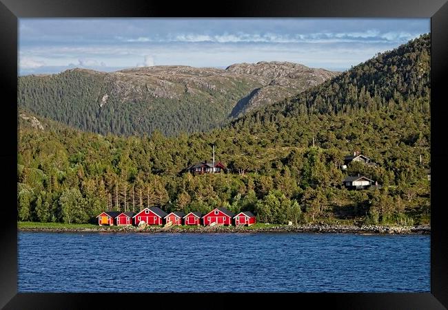 Boathouses in Norway Framed Print by Martyn Arnold