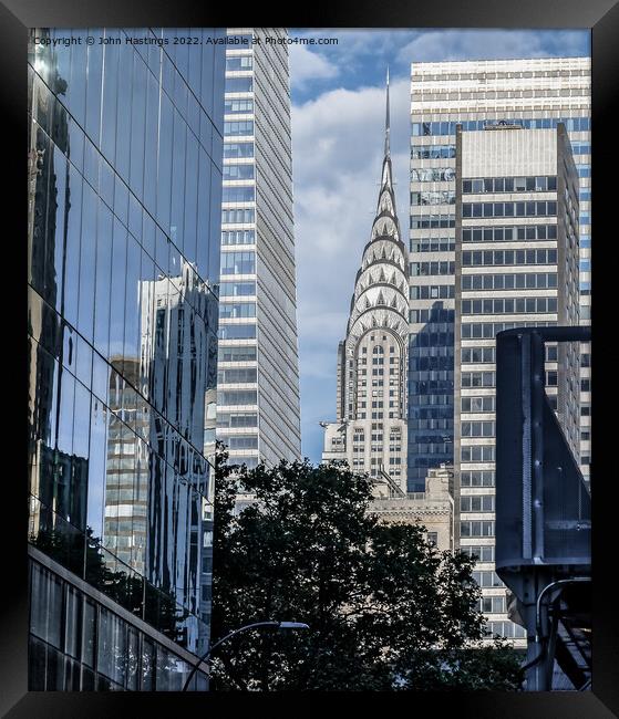 Reflecting on New York's Iconic Chrysler Building Framed Print by John Hastings