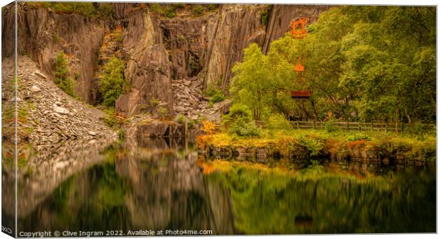 Deep reflections of a Welsh slate quarry Canvas Print by Clive Ingram