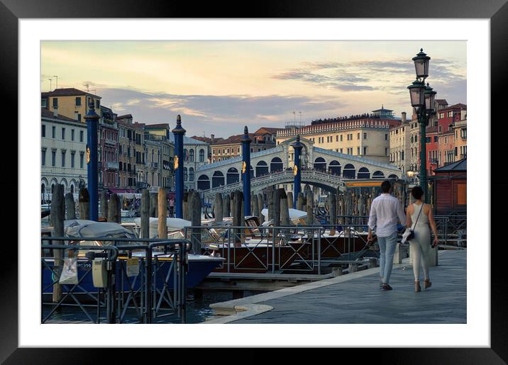 Venice, Italy A couple walking holding hands against rialto bridge, a famous place known as one of the romantic destination Framed Mounted Print by Arpan Bhatia