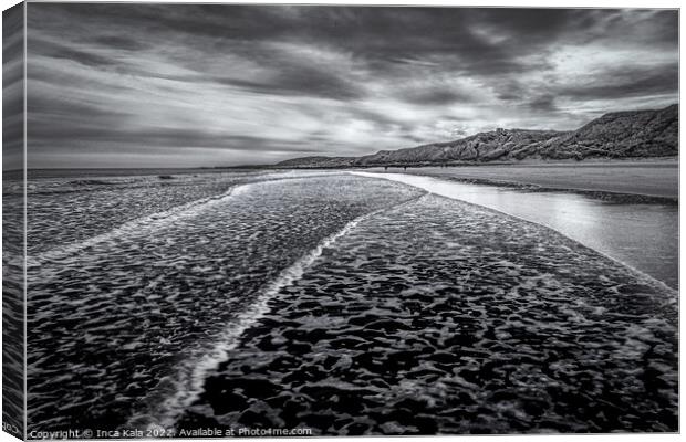 Waves Lapping Over Bamburgh Beach  Canvas Print by Inca Kala