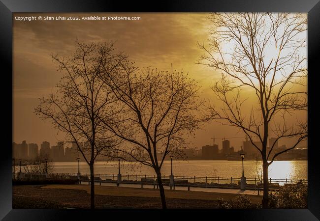 Sunset over the Huangpu river Framed Print by Stan Lihai