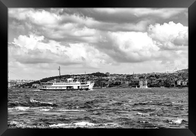 The ferry goes through the Bosphorus Strait. Istanbul, Turkey. Framed Print by Sergey Fedoskin