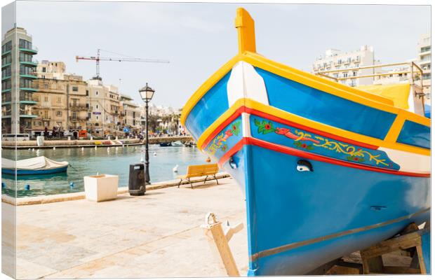 Luzzu boat on the edge of Spinola Bay Canvas Print by Jason Wells