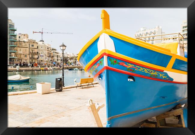 Luzzu boat on the edge of Spinola Bay Framed Print by Jason Wells
