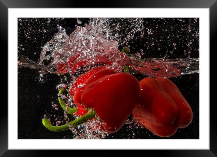 pepper splashing about Framed Mounted Print by kathy white