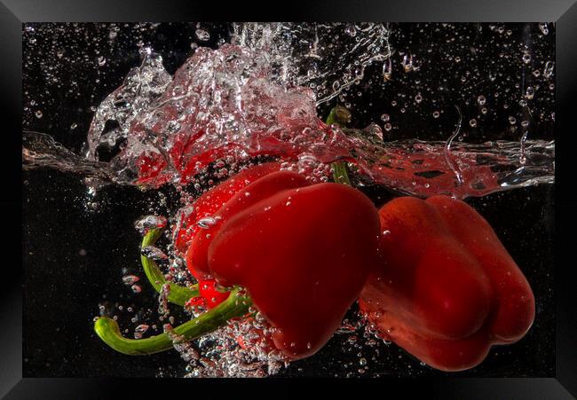 pepper splashing about Framed Print by kathy white
