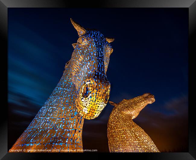 The Kelpies light up in Blue and Yellow colours in support of Uk Framed Print by George Robertson