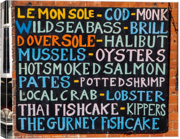 List of Fish on the exterior of a Fishmongers in Norfolk, UK Canvas Print by Chris Dorney
