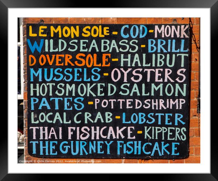 List of Fish on the exterior of a Fishmongers in Norfolk, UK Framed Mounted Print by Chris Dorney