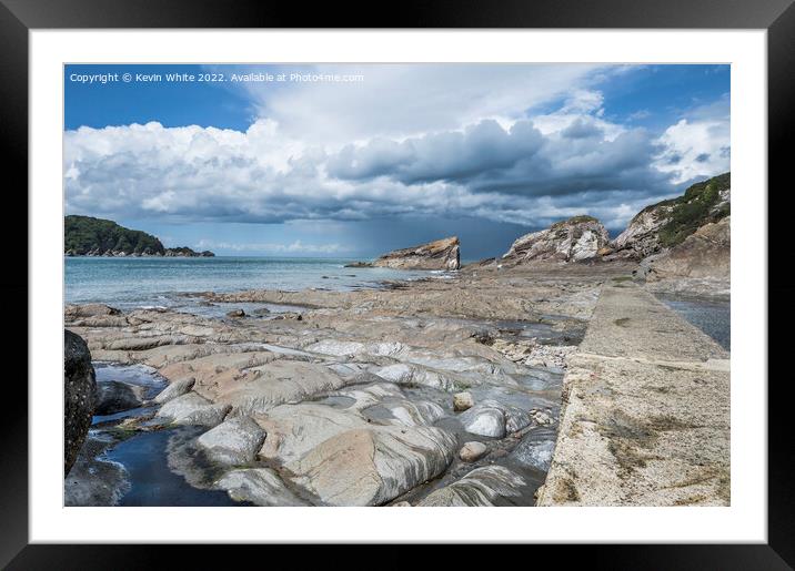 Storm clouds over Coombe Martin bay Framed Mounted Print by Kevin White