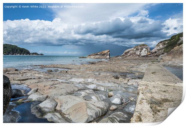 Storm clouds over Coombe Martin bay Print by Kevin White