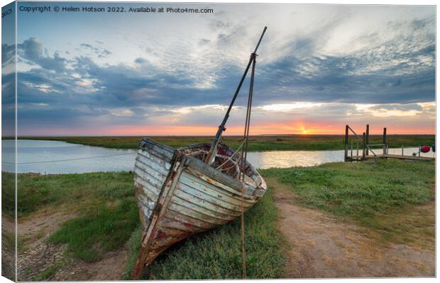 Sunrise over abandoned fishing boat on the shore at Thornham  Canvas Print by Helen Hotson