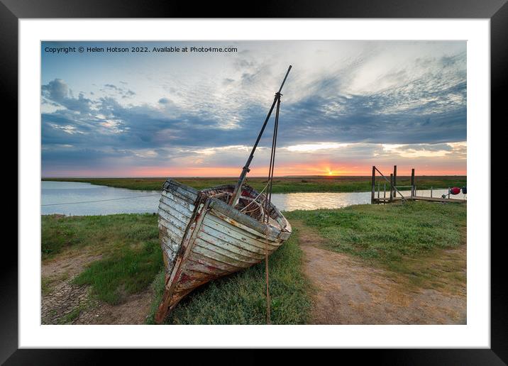 Sunrise over abandoned fishing boat on the shore at Thornham  Framed Mounted Print by Helen Hotson