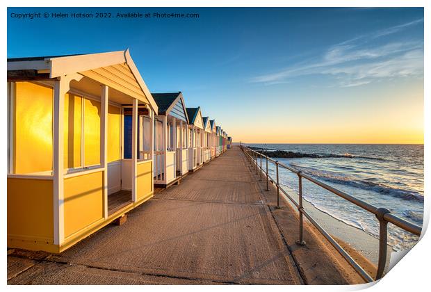 Colorful beach huts on the prom at Southwold Print by Helen Hotson