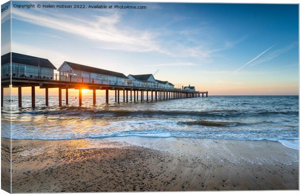 Beautiful sunrise over the pier at Southwold Canvas Print by Helen Hotson