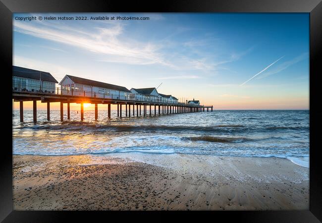 Beautiful sunrise over the pier at Southwold Framed Print by Helen Hotson