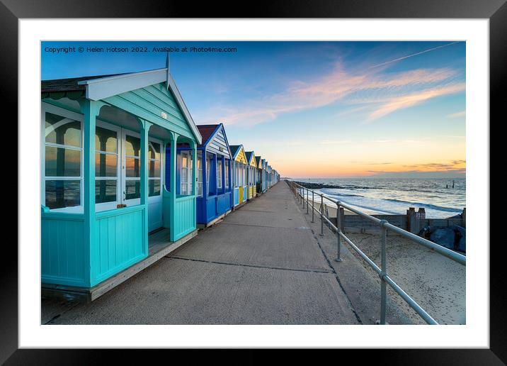 A row of colorful beach huts at Southwold Framed Mounted Print by Helen Hotson
