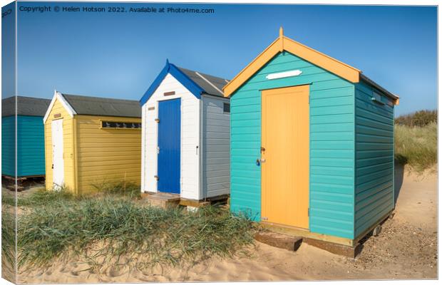 Beach Huts at Southwold Canvas Print by Helen Hotson