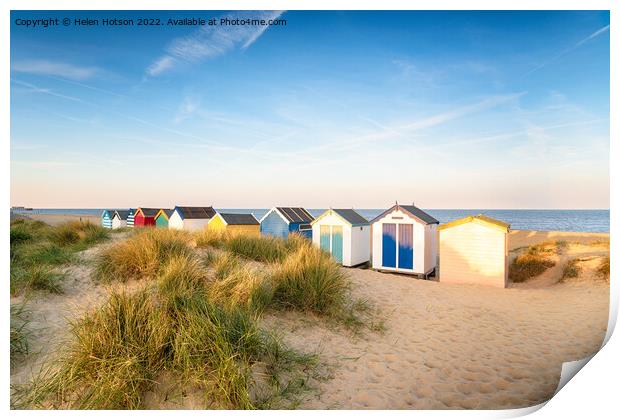 Colourfull beach huts in the sand dunes at Southwold Print by Helen Hotson