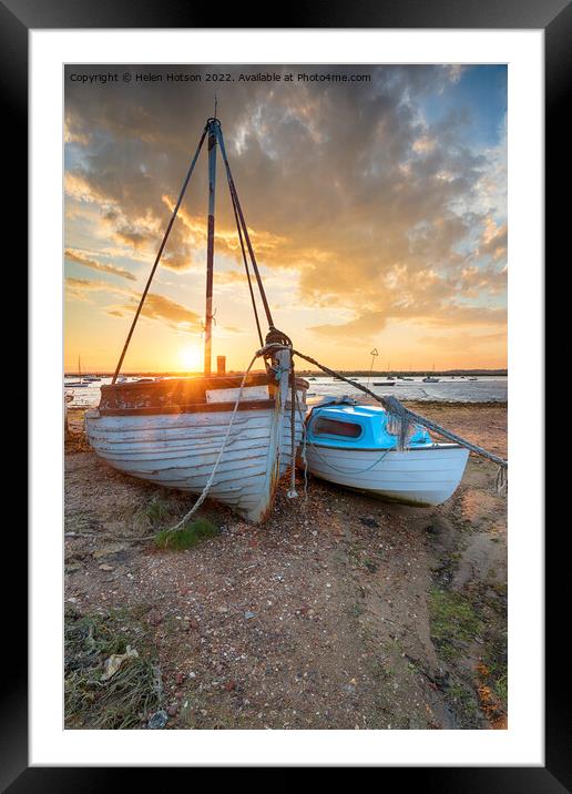 Stunning sunset over old fishing boats on the shore at West Mers Framed Mounted Print by Helen Hotson